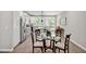 Open kitchen featuring white cabinets, stainless steel appliances, and eat-in dining area at 1824 Irish Blvd, Sanford, NC 27332