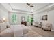 Relaxing bedroom featuring a tray ceiling, and two large windows offering an abundance of natural light at 1824 Irish Blvd, Sanford, NC 27332