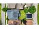 Birds eye view of a house with a gray roof and solar panels, green grass and beautiful landscaping at 1962 Briar Chapel Pkwy, Chapel Hill, NC 27516