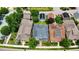 Aerial view of homes with solar panels, mature trees, and well-manicured lawns at 1962 Briar Chapel Pkwy, Chapel Hill, NC 27516