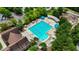 Aerial view of a large swimming pool, green umbrellas and comfortable seating at 1962 Briar Chapel Pkwy, Chapel Hill, NC 27516