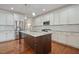 Kitchen featuring granite countertops, stainless steel appliances, and custom white cabinetry at 1962 Briar Chapel Pkwy, Chapel Hill, NC 27516