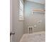 This laundry room features tile flooring, gray walls and white trim at 1962 Briar Chapel Pkwy, Chapel Hill, NC 27516