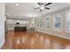 Open-concept living space showcasing the kitchen with a large island and dining area with shuttered windows at 1962 Briar Chapel Pkwy, Chapel Hill, NC 27516