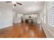 Open-concept living space showcasing the kitchen with a large island and dining area with shuttered windows at 1962 Briar Chapel Pkwy, Chapel Hill, NC 27516