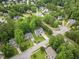 Residential neighborhood with mature trees and well-maintained lawns on a sunny day at 200 Holly Branch Dr, Holly Springs, NC 27540