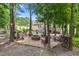 Outdoor fire pit area with Adirondack chairs, great for entertaining at 200 Holly Branch Dr, Holly Springs, NC 27540