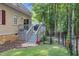Grilling deck and fenced backyard with mature trees offer outdoor living at 200 Holly Branch Dr, Holly Springs, NC 27540