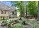 Backyard features a raised garden, patio, and fire pit at 200 Holly Branch Dr, Holly Springs, NC 27540