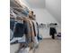Well-organized walk-in closet with ample storage space for clothes, shoes, and other personal items at 200 Holly Branch Dr, Holly Springs, NC 27540