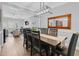 Dining room with modern light fixture and connection to living room at 200 Holly Branch Dr, Holly Springs, NC 27540