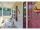 Charming front porch featuring the house number and a decorated door for a warm, inviting entrance at 200 Holly Branch Dr, Holly Springs, NC 27540