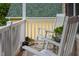 Relaxing front porch scene featuring rocking chairs and potted plants, ideal for unwinding and enjoying the outdoors at 200 Holly Branch Dr, Holly Springs, NC 27540