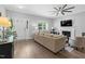 Bright living room features hardwood floors, fireplace, and lots of natural light at 200 Holly Branch Dr, Holly Springs, NC 27540
