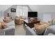 Cozy living room with comfortable seating, a television, and soft natural light at 200 Holly Branch Dr, Holly Springs, NC 27540