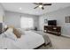 Calm main bedroom with a ceiling fan, neutral walls, and a comfortable bed at 200 Holly Branch Dr, Holly Springs, NC 27540