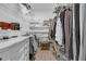 A well-organized walk-in closet with shelving and hanging space for clothes and accessories at 200 Holly Branch Dr, Holly Springs, NC 27540