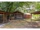 A backyard with a screened-in porch attached to the house at 2009 Carolina Ave, Durham, NC 27705