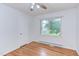 Cozy bedroom featuring hardwood floors, natural light, and a ceiling fan at 2009 Carolina Ave, Durham, NC 27705