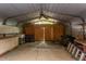 Spacious garage featuring a ceiling fan and access to the backyard at 2009 Carolina Ave, Durham, NC 27705