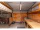 This garage features shelving for storage and a workbench for projects at 2009 Carolina Ave, Durham, NC 27705