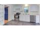 Functional kitchen with stainless steel appliances, white cabinets, and slate flooring for a modern touch at 2009 Carolina Ave, Durham, NC 27705