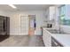 Bright, functional kitchen featuring modern appliances, white cabinetry, and slate flooring at 2009 Carolina Ave, Durham, NC 27705