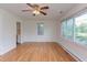 Bright living room with hardwood floors and multiple windows for ample natural light at 2009 Carolina Ave, Durham, NC 27705