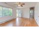 Bright living room with hardwood floors, large window, and access to entry and hallway, creating an open feel at 2009 Carolina Ave, Durham, NC 27705