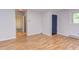 Bright living room boasts wood floors and natural light, enhancing its welcoming atmosphere at 2009 Carolina Ave, Durham, NC 27705