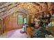 Unfinished attic space with exposed insulation and storage items at 201 Cobblestone Dr, Chapel Hill, NC 27516