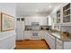 Bright kitchen with granite countertops, white cabinets, and stainless steel appliances at 201 Cobblestone Dr, Chapel Hill, NC 27516