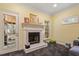 Cozy living room with fireplace and a door to a deck or patio at 201 Cobblestone Dr, Chapel Hill, NC 27516