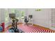 Bright office with home gym, large windows, and hardwood floors at 201 Cobblestone Dr, Chapel Hill, NC 27516