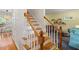 Bright stairway with white railings and hardwood steps, connecting different levels of the home at 201 Cobblestone Dr, Chapel Hill, NC 27516