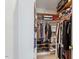 Spacious walk-in closet includes multiple shelves and clothing racks for optimal organization at 201 Cobblestone Dr, Chapel Hill, NC 27516