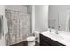 Bathroom with patterned shower curtain and tile flooring at 202 E Painted Way, Clayton, NC 27527