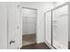 Bathroom with a glass-enclosed shower and a walk-in closet at 202 E Painted Way, Clayton, NC 27527