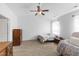 Cozy bedroom showcasing a twin bed and floral armchair at 202 E Painted Way, Clayton, NC 27527