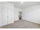 Empty bedroom with neutral carpet and closet at 202 E Painted Way, Clayton, NC 27527