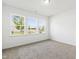 A bright, empty bedroom with three windows at 202 E Painted Way, Clayton, NC 27527