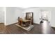 Bright dining room features wood floors, a dining table, and a beautiful hutch at 202 E Painted Way, Clayton, NC 27527