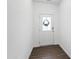 Inviting entryway showcasing a white front door adorned with a wreath, and hard floors at 202 E Painted Way, Clayton, NC 27527