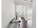 Inviting foyer featuring wood floors, a stylish table with a lamp, and a bright, welcoming entrance at 202 E Painted Way, Clayton, NC 27527