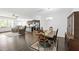 Open floor plan with living room, dining area, and kitchen with stainless steel appliances at 202 E Painted Way, Clayton, NC 27527