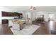 Spacious open-concept living area seamlessly connecting the kitchen, living, and dining spaces at 202 E Painted Way, Clayton, NC 27527
