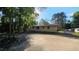 Back exterior of a cozy home, nestled in a tranquil, wooded neighborhood at 2100 N Webb St, Selma, NC 27576