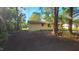 Cozy home with modest siding, nestled among lush trees for peaceful backyard privacy at 2100 N Webb St, Selma, NC 27576