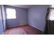 Comfortable bedroom featuring hardwood floors and a window at 2100 N Webb St, Selma, NC 27576