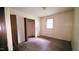 Cozy bedroom featuring a closet, window, and hardwood floors at 2100 N Webb St, Selma, NC 27576